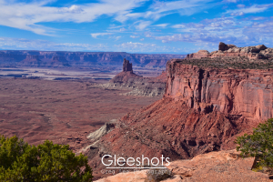 A view of the deep red rock cliffs surrounding Candlestick Tower in Canyonlands National Park.  Utah Fine Art Landscape Photography Print for Sale.