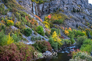 In this autumn scene, the Provo River flows through Provo Canyon, with Bridal Veil Falls cascading down the rocky mountain in the background.  Utah Landscape Photography Print for Sale.